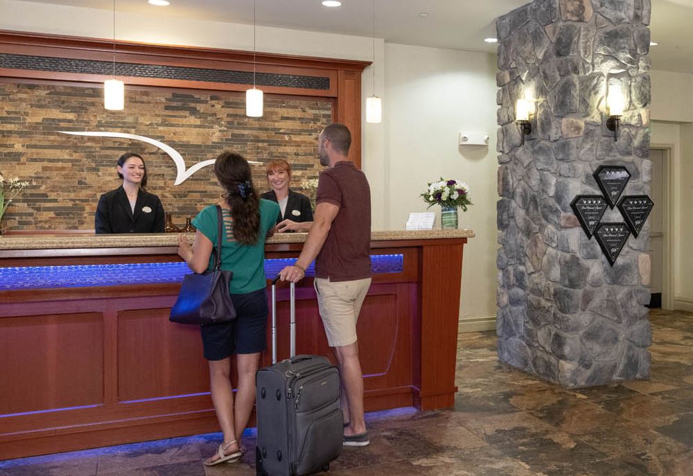 A couple checking in at the lobby of the 1000 Islands Harbor Hotel