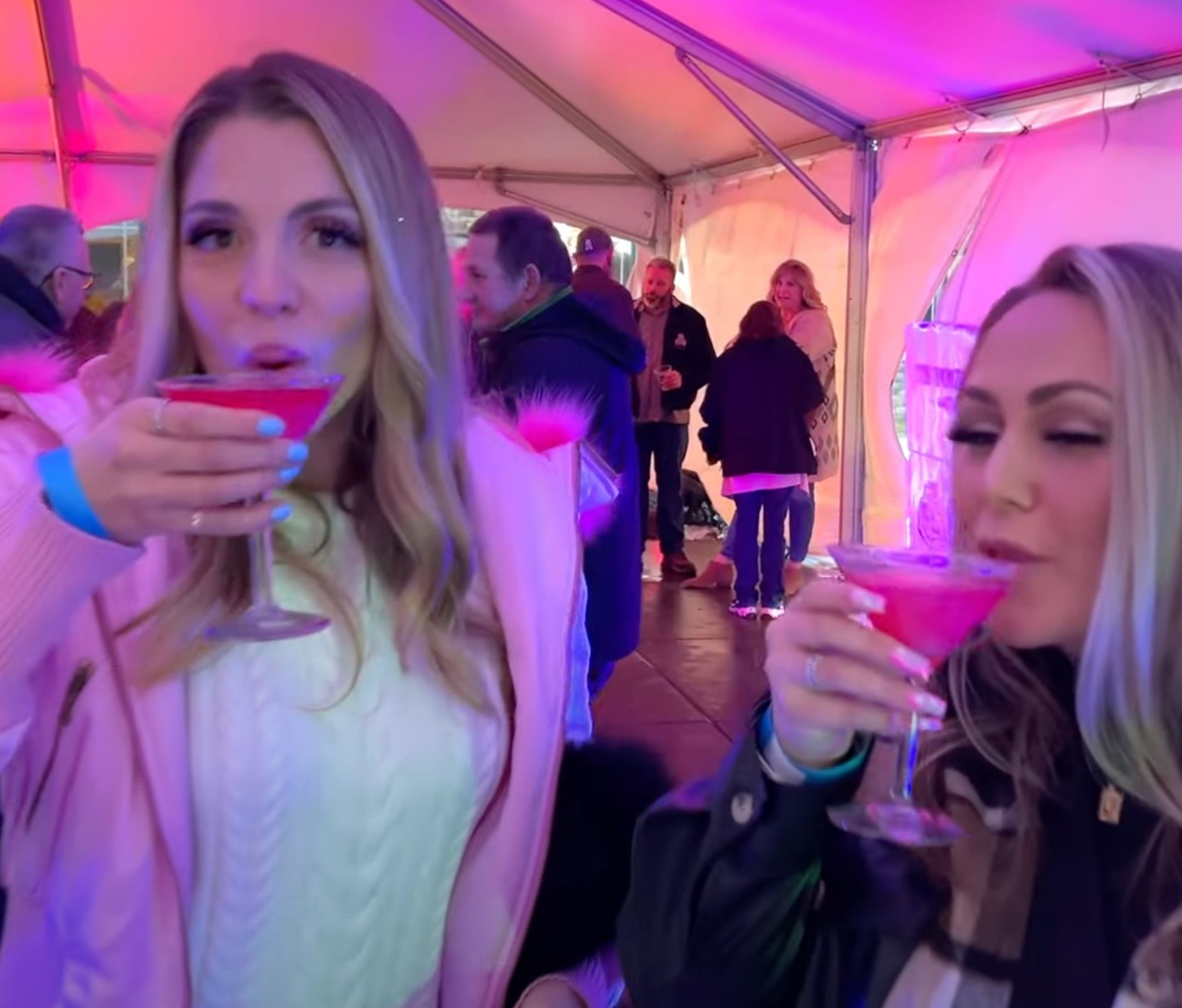 Two women drinking cocktails during the Fire and Ice celebration at the 1000 Islands Harbor Hotel