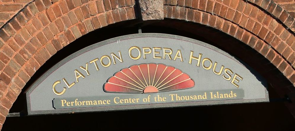 The entrance to the Clayton Opera House with lettering under a brick arch