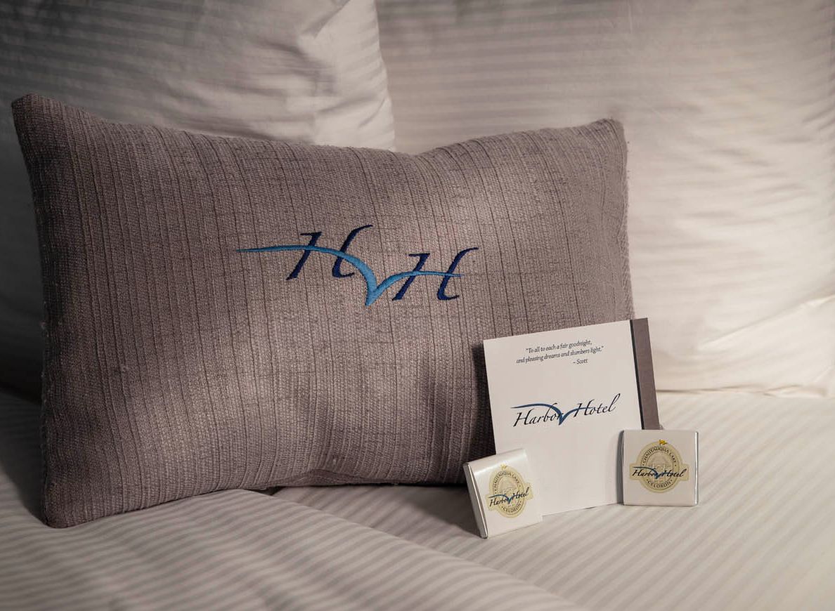 Several chocolates arranged on a neat pillow for evening turn-down service