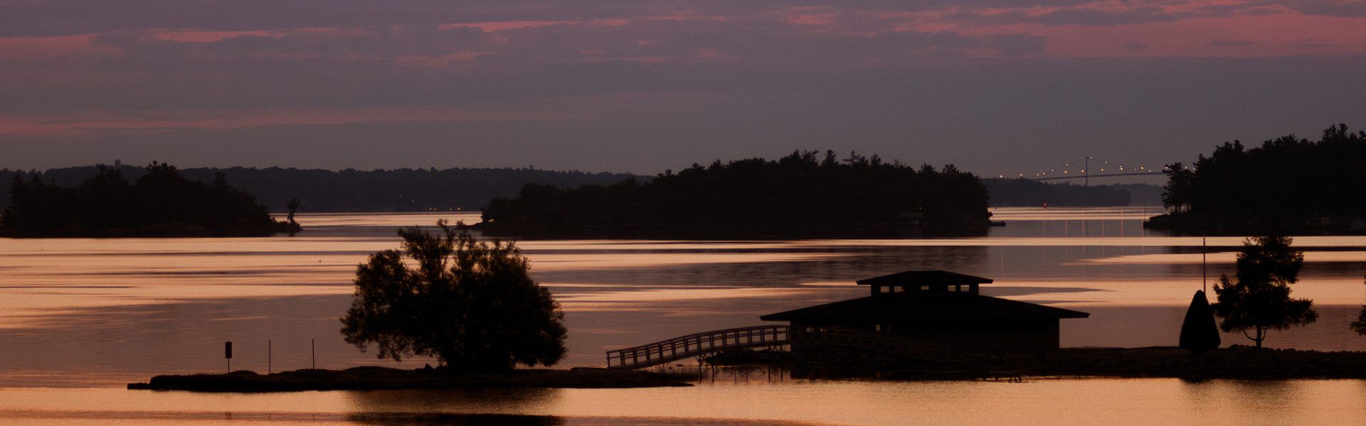 Sunset with small islands and boathouse