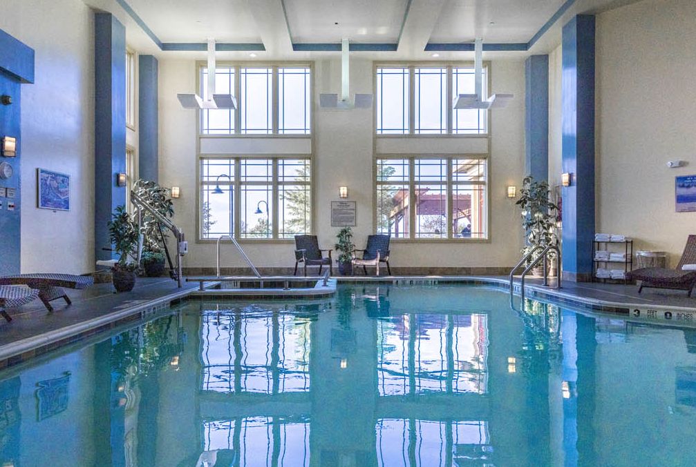 The indoor pool looking through the large glass windows at the 1000 Islands Harbor Hotel